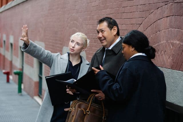 Real Estate agents discussing local marketing plans